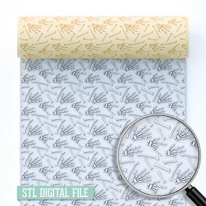 May include: A rolled beige material and a flat sheet, both featuring a repeating pattern of skeleton hands and bones. The flat sheet has a light blue background with white bones. Text at the bottom reads "STL DIGITAL FILE".