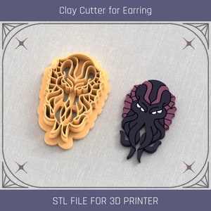 May include: Two 3D printed clay cutters for earrings. One cutter is a detailed floral design, the other is a black and purple Cthulhu-like creature.