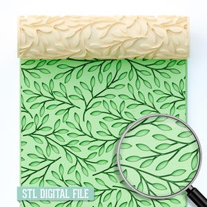 May include: A beige rolling pin with a leaf pattern is positioned above a green surface with a matching leaf design. The words "STL DIGITAL FILE" are at the bottom. A magnifying glass shows a close-up of the leaf pattern.