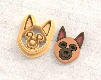 May include: Two 3D printed dog head cookie cutters, one in light brown and one in a darker brown. The cutters are designed for making clay earrings. The text "Clay Cutter for Earring" and "STL FILE FOR 3D PRINTER" are visible in the image.