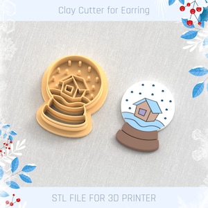 May include: A 3D printed clay cutter for earrings in the shape of a snow globe with a house inside. The cutter is brown and has a white background. The text "STL FILE FOR 3D PRINTER" is at the bottom of the image.