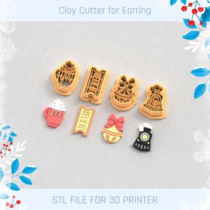 May include: A collection of clay cutters for earrings, including a train, a cup of hot chocolate, a ticket that says "BELIEVE", and a bell with a bow. The text "Clay Cutter for Earring" and "STL FILE FOR 3D PRINTER" are also visible.