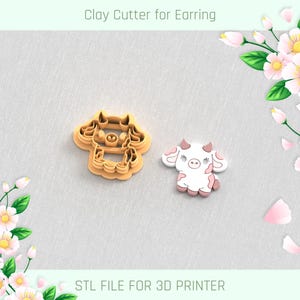 May include: A clay cutter and a finished earring in the shape of a cartoon cow. The cutter is tan, and the earring is white with pink spots and accents. Text at the top reads "Clay Cutter for Earring" and at the bottom "STL FILE FOR 3D PRINTER."