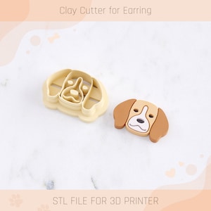 May include: A 3D printed clay cutter for earrings shaped like a beagle dog. The cutter is beige and brown with a white nose and eyes. The image also shows the cutter's STL file for 3D printing.