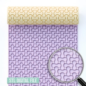 May include: A light beige rolling pin with a repeating pattern, resting on a lavender surface with the same pattern. A magnifying glass shows a close-up of the design. The text "STL DIGITAL FILE" is at the bottom.