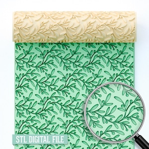May include: A beige rolling pin with a leaf pattern is shown above a green surface with a matching leaf design. A magnifying glass reveals a close-up of the leaf pattern. The text "STL DIGITAL FILE" is at the bottom.