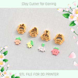 May include: A collection of clay cutters and finished earrings in the shape of vegetables. The cutters are tan, and the earrings are pink, green, and white. Text at the top reads "Clay Cutter for Earring" and at the bottom "STL FILE FOR 3D PRINTER."