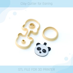 May include: A set of three 3D printed cookie cutters for making panda-shaped earrings. The cutters are beige and feature a panda face, a circle, and a smaller circle for the panda's ears. The text "Clay Cutter for Earring" and "STL FILE FOR 3D PRINTER" are visible in the image.
