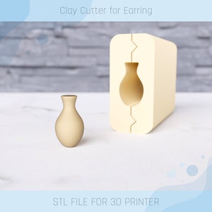 Peut inclure: Un emporte-pièce en argile imprimé en 3D pour boucles d'oreilles en forme de vase. L'emporte-pièce est beige et a une surface lisse. Le texte "STL FILE FOR 3D PRINTER" est imprimé sous l'image.