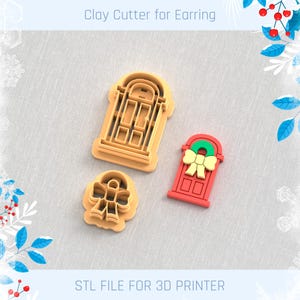 May include: Three 3D printed cookie cutters for making Christmas-themed cookies. The cutters are shaped like a door with a wreath, a door with a bow, and a bow. The cutters are made of a light brown plastic and are ready to be used for baking.