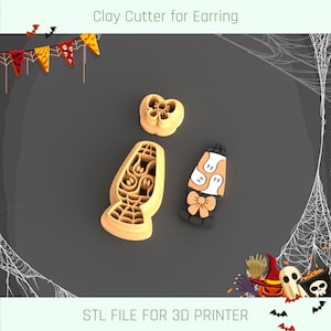 May include: Three clay cutters for earrings. One is a butterfly shape, another is a tall, curved shape with a spiderweb design, and the third is a Halloween-themed lamp. The text "Clay Cutter for Earring" and "STL FILE FOR 3D PRINTER" are visible.