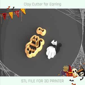 Op de afbeelding: Een 3D-geprint STL-bestand voor een klei-uitsteker in de vorm van een kat met een strik. De uitsteker is ontworpen voor het maken van oorbellen.