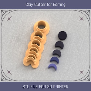 May include: A set of 3D printable clay cutters for making earrings. The cutters are shaped like crescent moons in various sizes. The cutters are made of a light brown plastic and are arranged in a vertical line. The image also shows the finished earrings in black, gray, and blue.