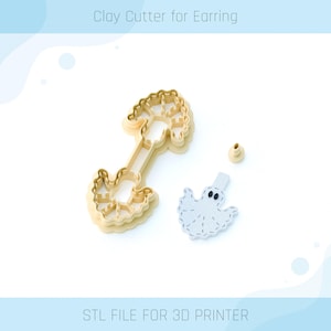 May include: A light beige clay cutter for earrings, featuring a tree-like design and a ghost shape. The image also includes a small beige cylinder and the text "Clay Cutter for Earring" and "STL FILE FOR 3D PRINTER".