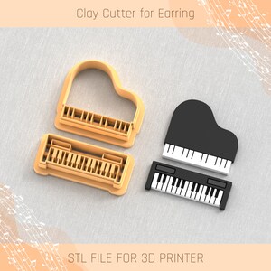 Könnte beinhalten: Zwei 3D-gedruckte Ausstecher in Form von Konzertflügeln. Die Ausstecher sind zum Ausstechen von Fondant oder Polymer Clay Ohrringen gedacht. Der Text "STL FILE FOR 3D PRINTER" befindet sich am unteren Rand des Bildes.