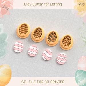 May include: Set of six 3D printed clay cutters shaped like Easter eggs with different patterns. The cutters are orange and the eggs are pink with white patterns. The text "Clay Cutter for Earring" and "STL FILE FOR 3D PRINTER" are visible in the image.