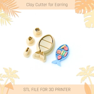 May include: A set of beige plastic clay cutters for earrings, including a large fish-shaped cutter, three smaller geometric cutters, and a blue fish-shaped tray containing small colorful clay shapes. Text reads: Clay Cutter for Earring, STL FILE FOR 3D PRINTER.