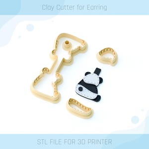 May include: Clay cutters for earrings and a panda-shaped earring. The cutters are beige and the panda earring is black and white. The text "Clay Cutter for Earring" and "STL FILE FOR 3D PRINTER" are visible.