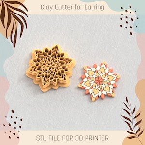 May include: Two 3D printed clay cutters in the shape of a flower. The cutters are made of a light brown plastic and have a detailed design. The text "STL FILE FOR 3D PRINTER" is printed below the cutters.