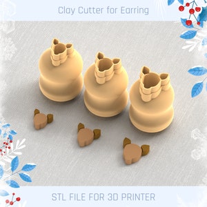 May include: Three clay cutters for earrings, each with a different design. The cutters are beige and have a smooth finish. There are also three smaller beige clay cutters in the shape of earrings. The text "STL FILE FOR 3D PRINTER" is at the bottom of the image.