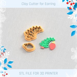 May include: Clay cutters for earrings in the shape of a Christmas tree, a Christmas light, and a pine branch. The cutters are tan and the Christmas light is red and green. The text "Clay Cutter for Earring" and "STL FILE FOR 3D PRINTER" are visible.