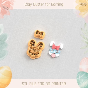 Könnte beinhalten: Ton-Ausstecher für Ohrringe in Form einer Schleife und eines Hasenkopfes mit Brille. Ein fertiger Hasenohrring mit rosa Schleife und Kaugummi ist ebenfalls abgebildet. Der Text "Clay Cutter for Earring" und "STL FILE FOR 3D PRINTER" werden angezeigt.