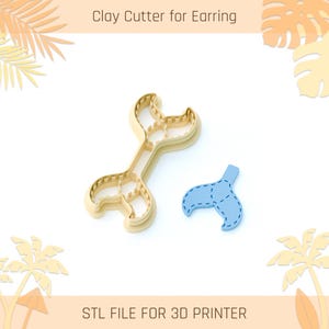 Może przedstawiać: Beżowy wykrawacz do kolczyków w kształcie ogona syreny i osobny niebieski element w kształcie ogona. Wyświetlany jest tekst "Clay Cutter for Earring" i "STL FILE FOR 3D PRINTER".