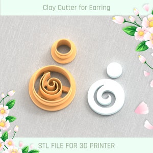May include: A set of three clay cutters for earrings, featuring a spiral design. The cutters are made for 3D printing and are shown on a textured fabric background. STL FILE FOR 3D PRINTER.