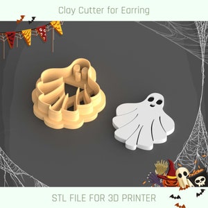 May include: A 3D printed cookie cutter in the shape of a ghost. The cutter is made of a light brown plastic and is designed to cut out ghost shapes from cookie dough. The cutter is shown next to a white ghost cutout.