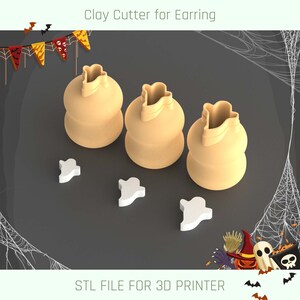 May include: Three 3D printed clay cutters shaped like ghost bags for making Halloween earrings. The cutters are beige and are sitting on a dark grey surface.  STL FILE FOR 3D PRINTER.