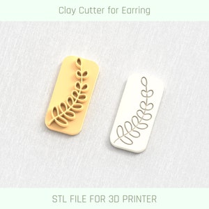 May include: Two 3D printed clay cutters for earrings, one in white and one in yellow, with a leaf design. STL FILE FOR 3D PRINTER.