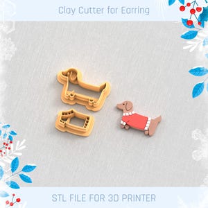 以下が含まれることがあります： ダックスフントの形をした3Dプリントされたクッキーカッターが2つ。1つのカッターはソリッドなダックスフント、もう1つはセーターを着たダックスフント。カッターは粘土で使用するために作られており、「Clay Cutter for Earring」とラベル付けされています。画像には「STL FILE FOR 3D PRINTER」というテキストも含まれています。