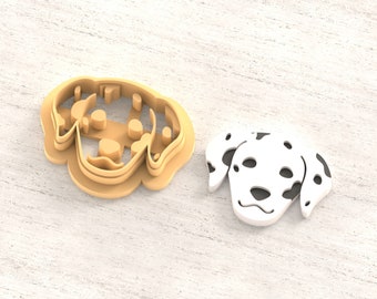 May include: A 3D printed clay cutter for earrings, shaped like a Dalmatian dog. The cutter is beige and the dog is white with black spots. The text "Clay Cutter for Earring" and "STL FILE FOR 3D PRINTER" are visible in the image.