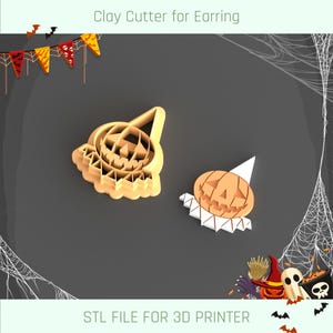 May include: Two 3D printed pumpkin-shaped clay cutters for earrings. The cutters are orange and have a jack-o'-lantern face. The text "STL FILE FOR 3D PRINTER" is at the bottom of the image.