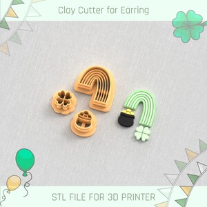 Op de afbeelding: Kleisnijders voor oorbellen in de vorm van een regenboog, klaver en pot met goud. De snijders zijn lichtoranje en groen. Tekst op de afbeelding luidt "Clay Cutter for Earring" en "STL FILE FOR 3D PRINTER."