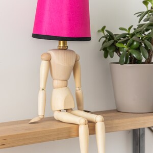 Handcrafted Wooden Mannequin Table Lamp with Luxurious Silk Lampshade - Artisan Sculptural Decor for Home or Office - Unique Boho Lighting Accent. 
Man cave lamp, Dorm light, Christmas Gift
Housewarming Gift
Desk Light, Unusual Gift, Table lamp