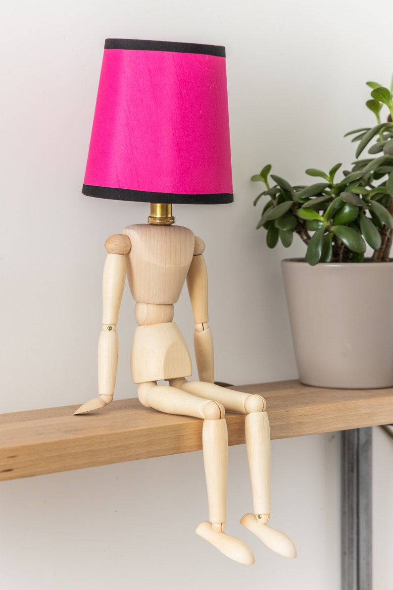 Handcrafted Wooden Mannequin Table Lamp with Luxurious Silk Lampshade - Artisan Sculptural Decor for Home or Office - Unique Boho Lighting Accent. 
Man cave lamp, Dorm light, Christmas Gift
Housewarming Gift
Desk Light, Unusual Gift, Table lamp