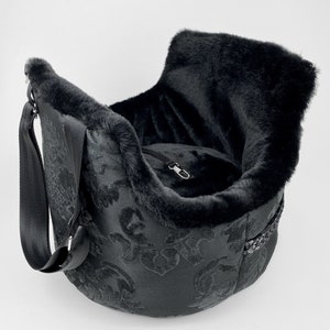 Black dog carrier with cushion