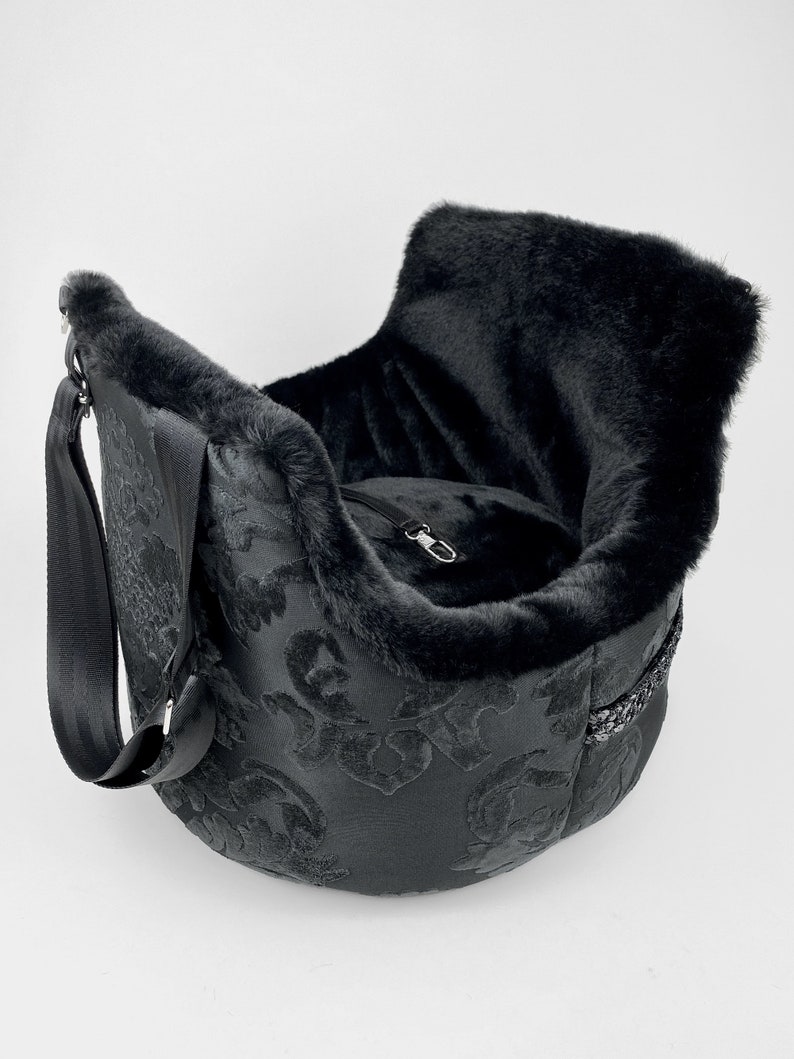 Black dog carrier with cushion