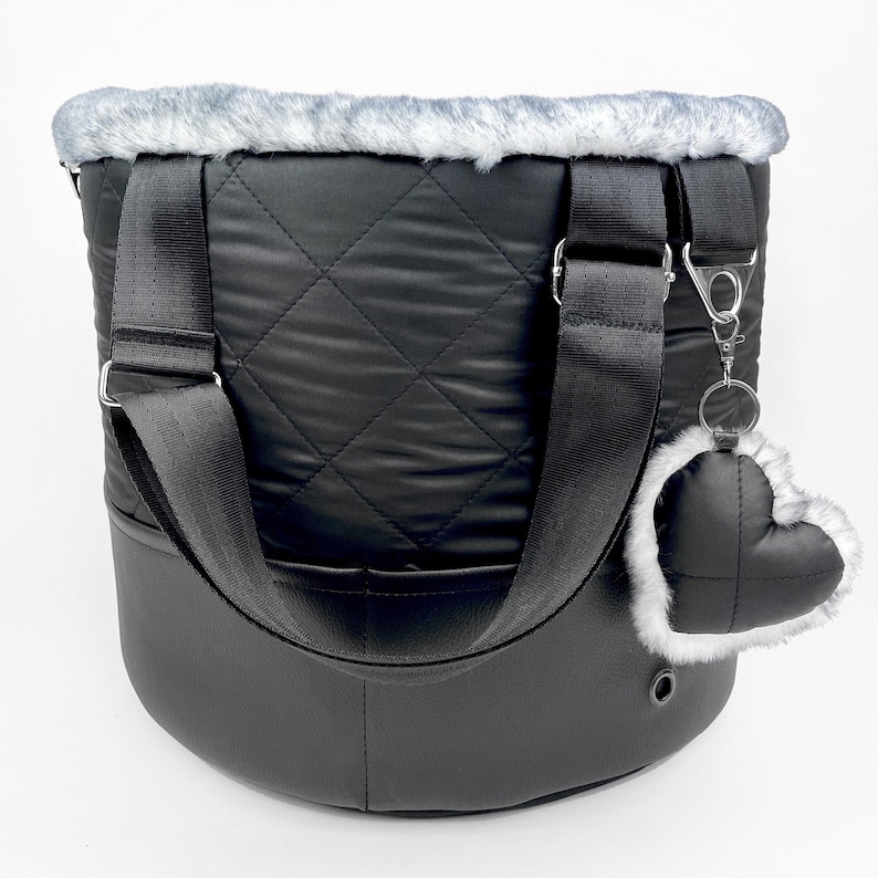 Luxury black dog carrier tote bag from water repellent quilted fabric and vegan leather with fluffy gray faux fur lining
