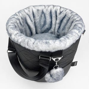 Round 2 in 1 dog carrier bag and bed from black quilted fabric with soft gray faux fur lining and length adjustable shoulder straps