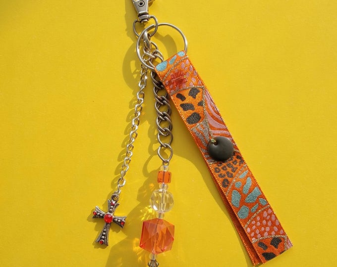 Bag jewel in pearls and precious orange ribbon and cross charm and chain handmade in a unique piece handcrafted in France