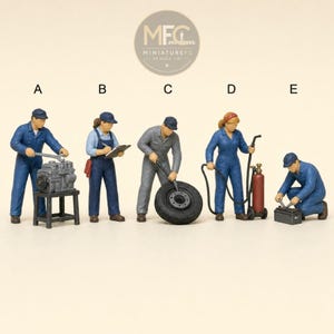 May include: Five miniature mechanic figurines labeled A through E. Figure A works on an engine, B holds a clipboard, C rolls a tire, D operates a red welding tank, and E kneels while working on a battery. Each wears a uniform and a cap.