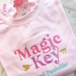 Magic Key Disney Jahreskartenbesitzer besticktes Sweatshirt - Rosa
