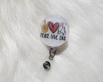 May include: A white glitter badge holder with a peace sign, heart, and medical symbols. The text "Peace. Love. CNA" is printed on the badge holder.