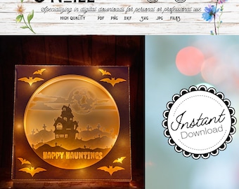 May include: A digital download of a Halloween-themed light-up box with a haunted house, bats, and a full moon. The text "Happy Hauntings" is displayed on the box.