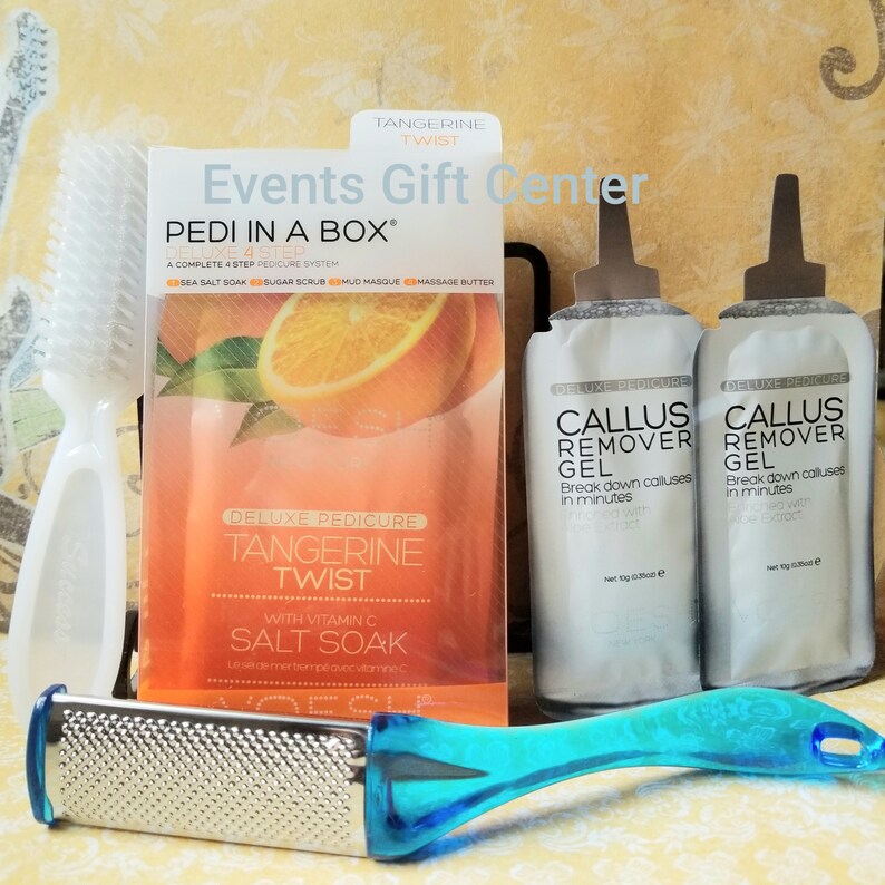 May include: A pedicure kit with a tangerine twist theme. The kit includes a foot scrub, a salt soak, a callus remover gel, and a foot file. The packaging is orange and white with the text "Tangerine Twist" and "Pedi in a Box".
