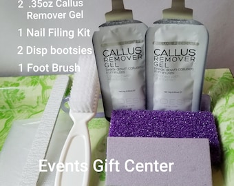 May include: A foot care kit with two packets of callus remover gel, a nail file, two disposable booties, a foot brush, and a purple pumice stone. The kit is labeled "Deluxe Pedicure" and includes the text "Callus Remover Gel" and "Break down calluses in minutes". The kit is on a green and white patterned surface. The text "Events Gift Center" is visible on the surface.