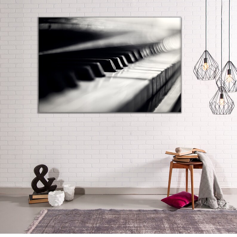 May include: A close-up of a black and white piano keyboard. The keys are slightly blurred, creating a soft, dreamy effect.