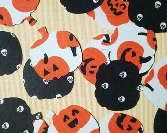 Halloween Pumpkin Table Scatters, jack o'lanterns and skulls on black pumpkins, confetti, table decorations